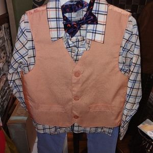 Boys size six button down with vest and pants and Velcro tie.nwot never worn.